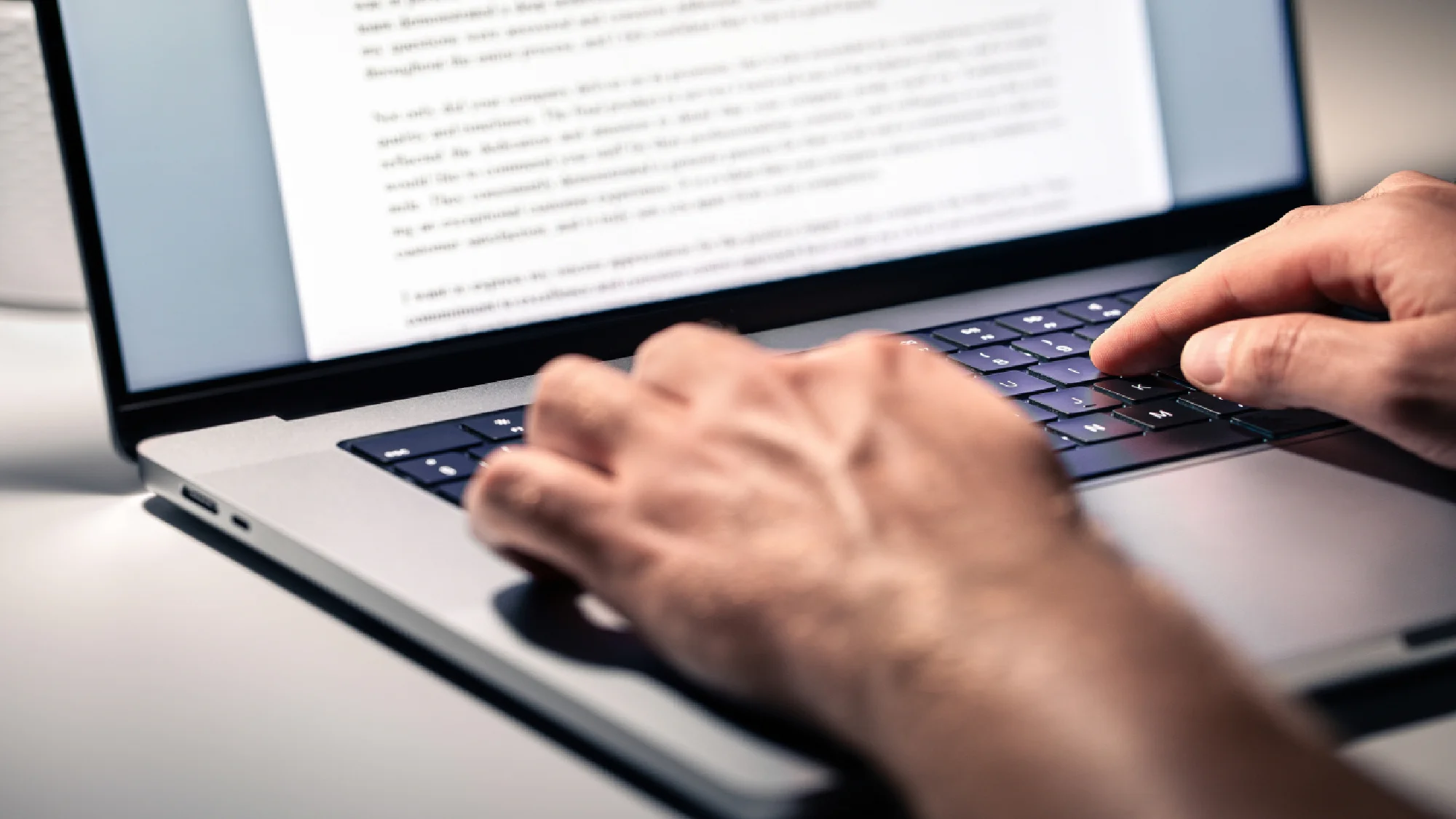 Writer typing on keyboard